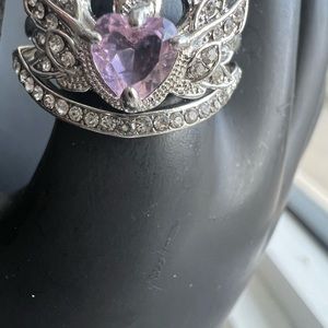 Two ring in one set . Size 8 silver heart shape pink center piece.